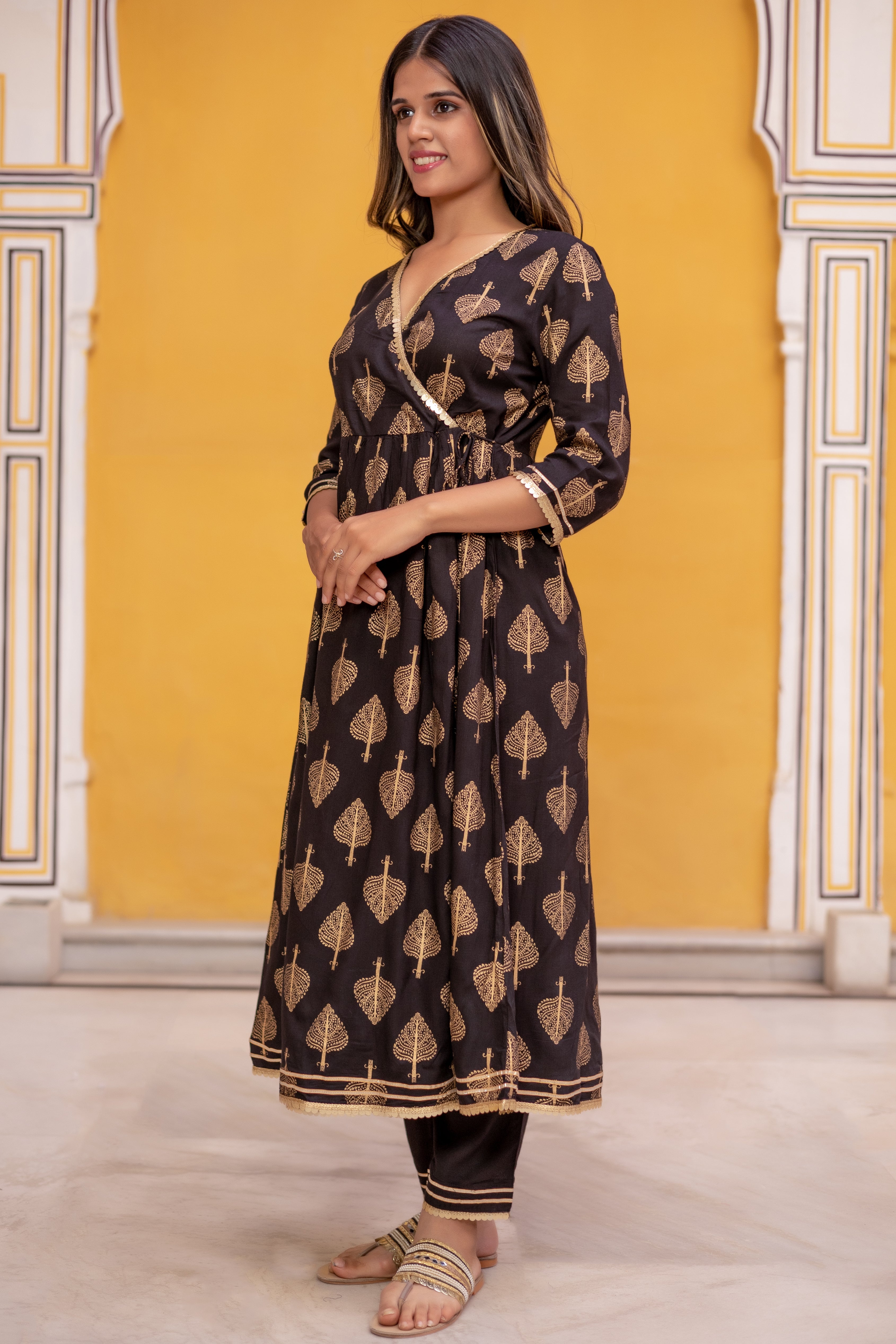Black Gold Printed Angarkha Style Flared Kurti with Gathers and Narrow Pant.